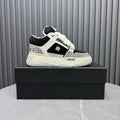 White and black sneakers with lace-up front and textured side panels