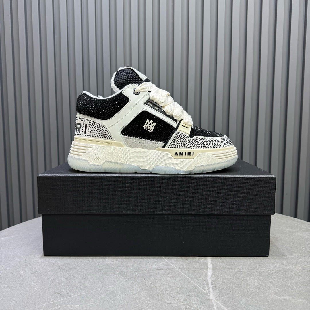 White and black sneakers with lace-up front and textured side panels