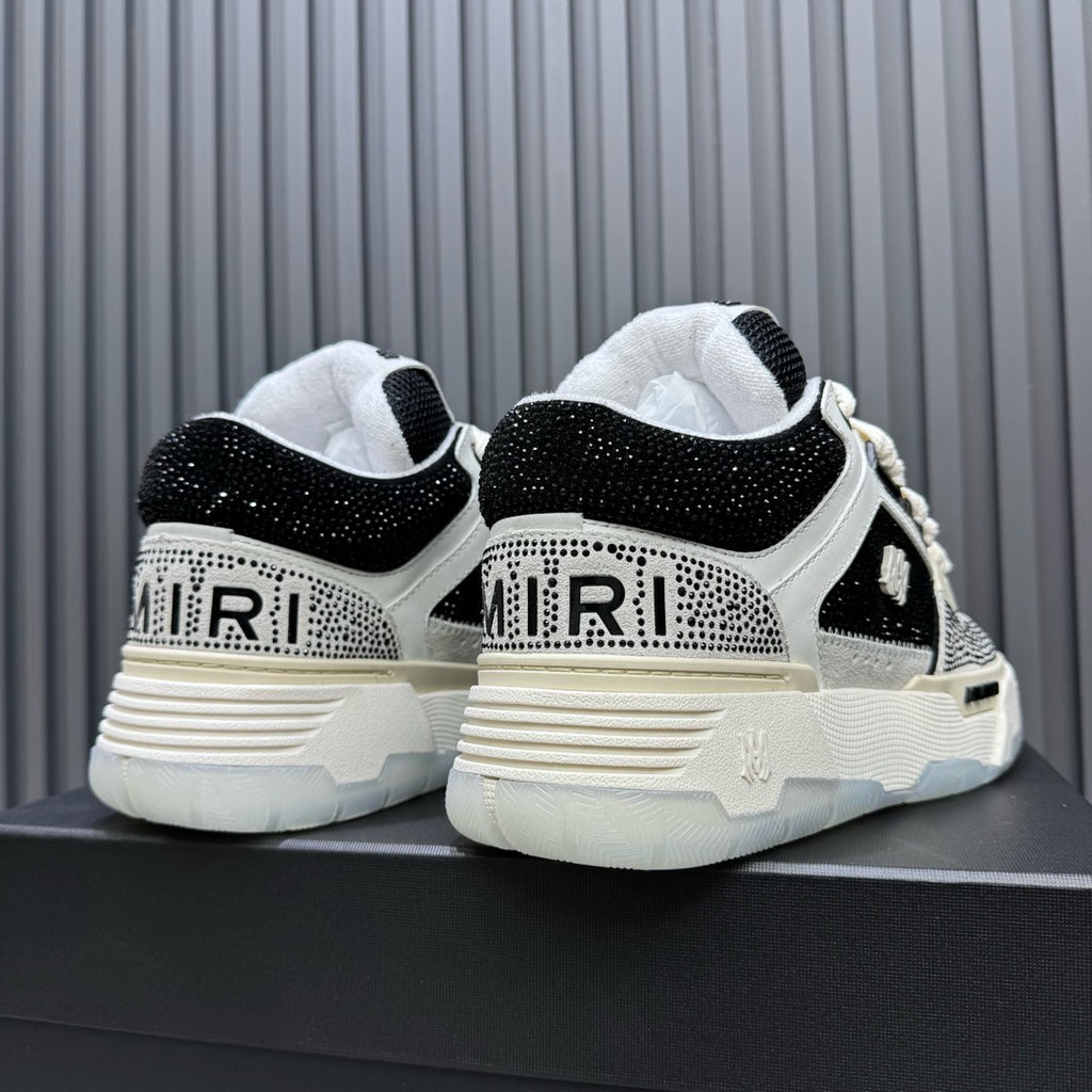 Black and white sneakers viewed from back, showing heel branding