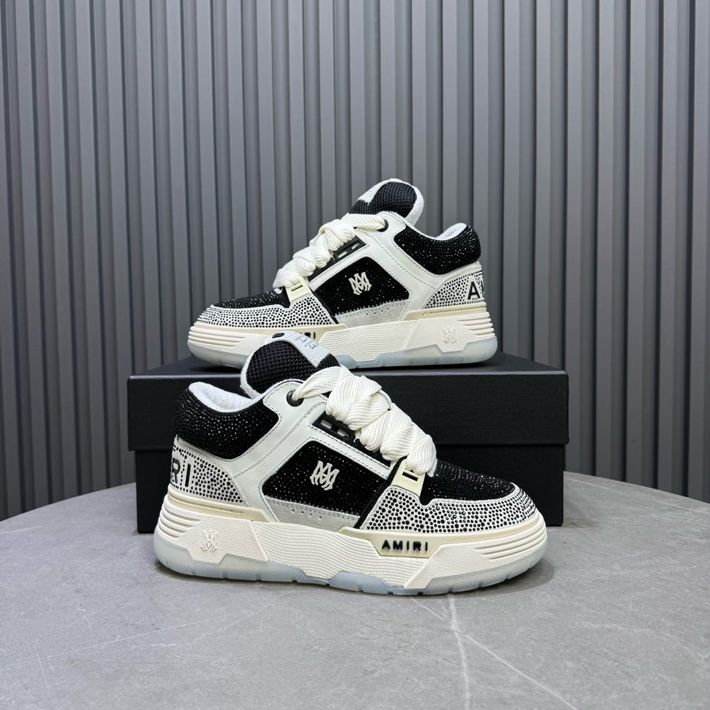 Black and white sneakers on a box, side view with lace-up upper