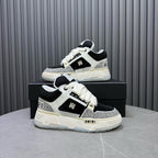 Black and white sneakers on a box, side view with lace-up upper