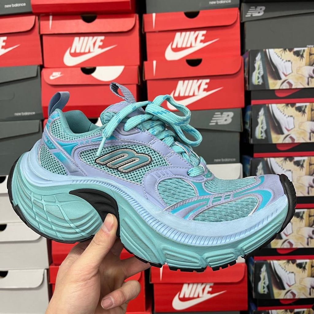 Teal and lavender athletic sneaker with turquoise laces and cushioned sole