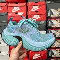Teal and lavender athletic sneaker with turquoise laces and cushioned sole