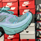 Lavender and teal sneaker side profile with chunky sole and black tread