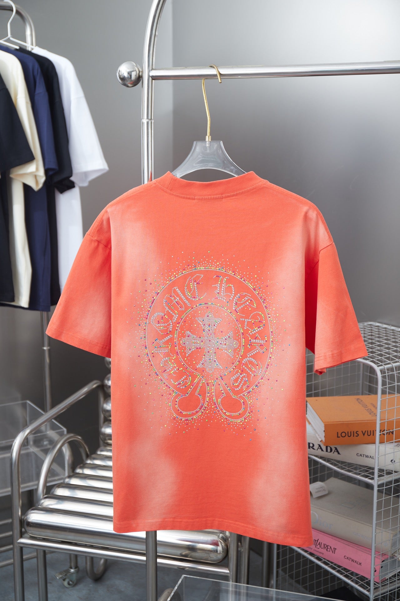 Coral orange short-sleeve crewneck T-shirt with large rhinestone back graphic