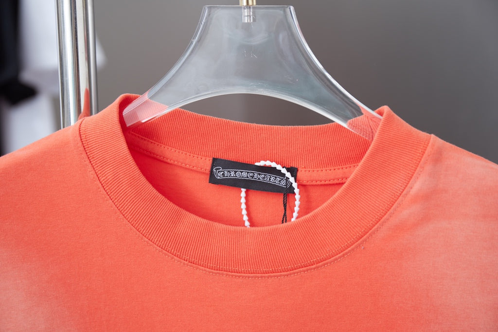 Coral orange crewneck T-shirt neckline with interior label and short sleeves