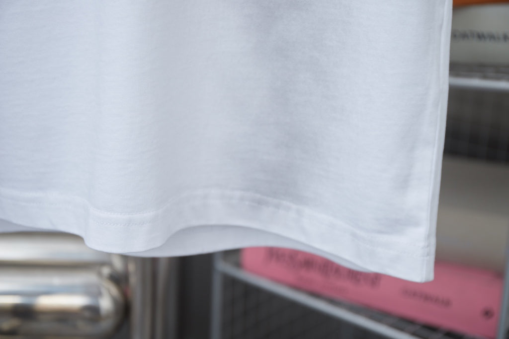 White short-sleeve T-shirt with stitched hem and clean bottom edge