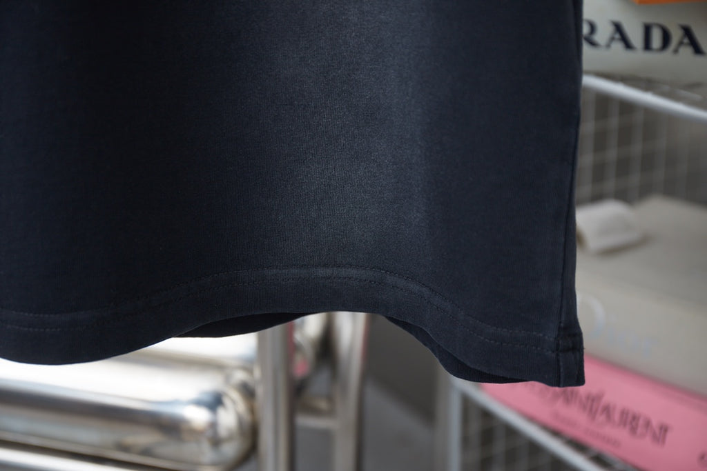 Navy short-sleeve T-shirt hem with clean stitched edge