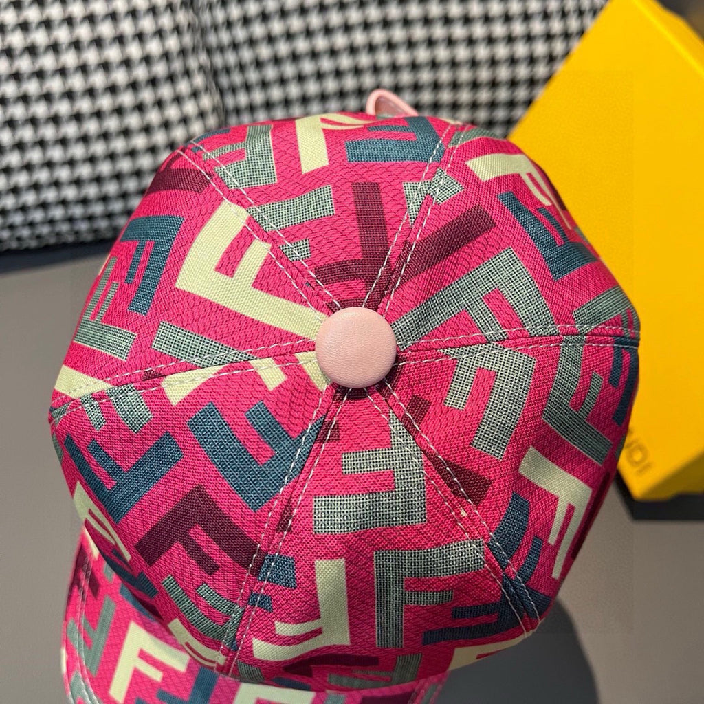 Fendi cap crown detail with pink FF logo pattern and round beige button at top