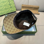 Gucci cap with tan GG monogram exterior and black inner crown lining