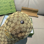 Gucci cap in tan GG monogram with front button and curved brim