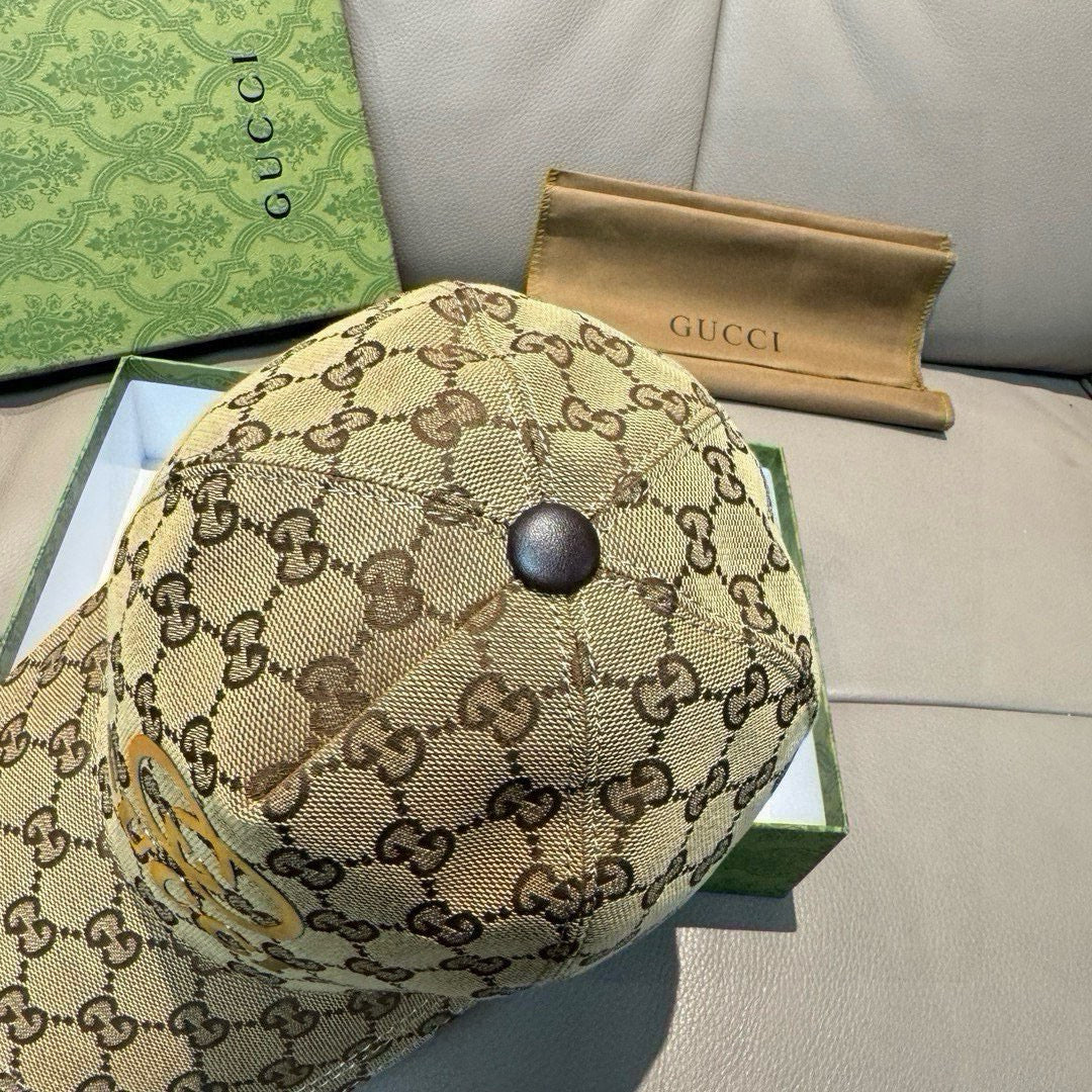 Gucci cap in tan GG monogram with front button and curved brim