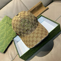 Gucci cap in tan GG monogram canvas with green web stripe and curved brim
