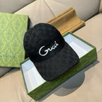 Gucci cap in dark GG monogram fabric with white script logo