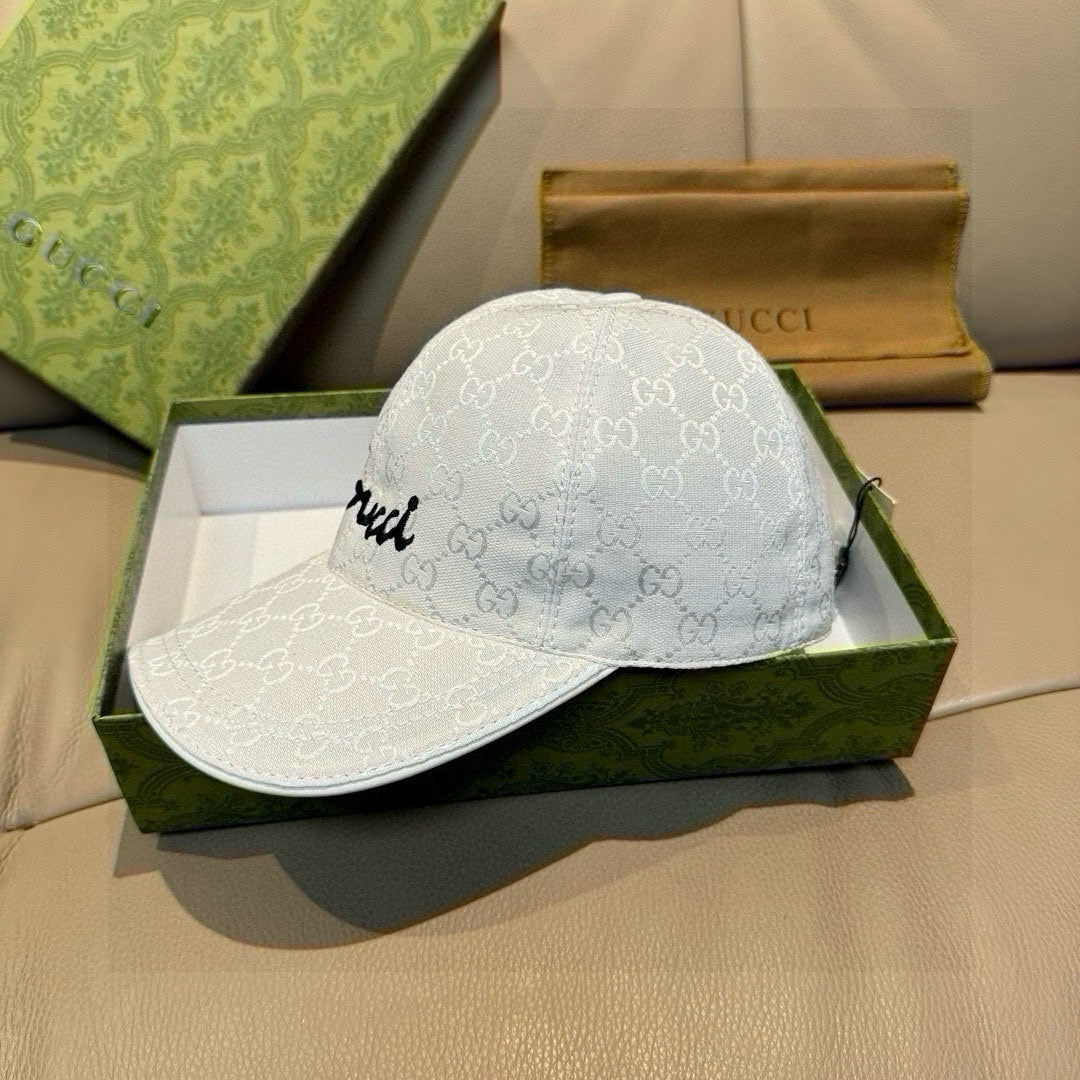 White GG monogram baseball cap with black cursive logo on side panel