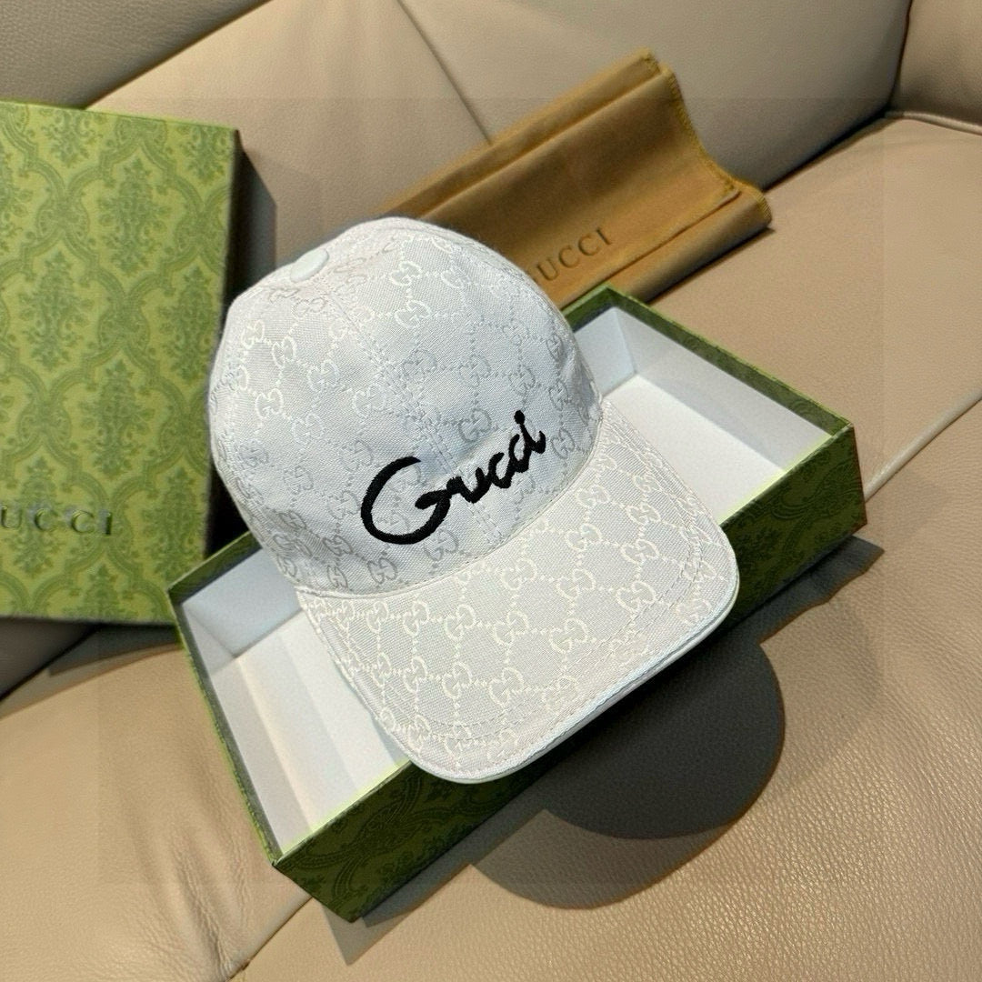 Gucci GG monogram baseball cap in white with black cursive logo on front