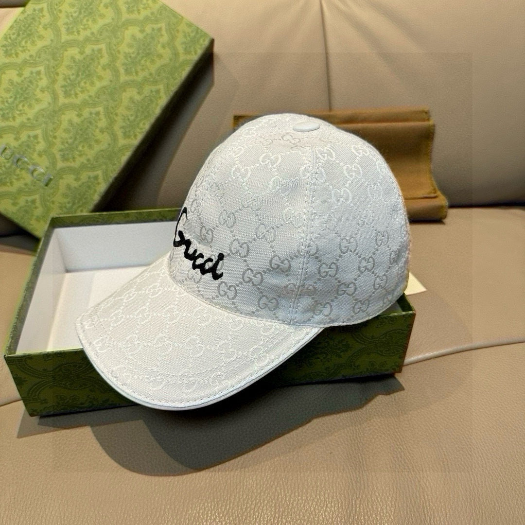 White GG monogram baseball cap with black cursive logo embroidery