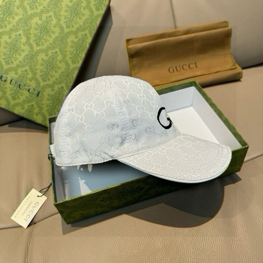 White GG monogram baseball cap with black G emblem on front