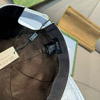 Baseball cap interior with adjustable strap and hanging authenticity tags
