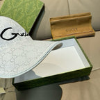 White GG monogram baseball cap with black cursive logo on front