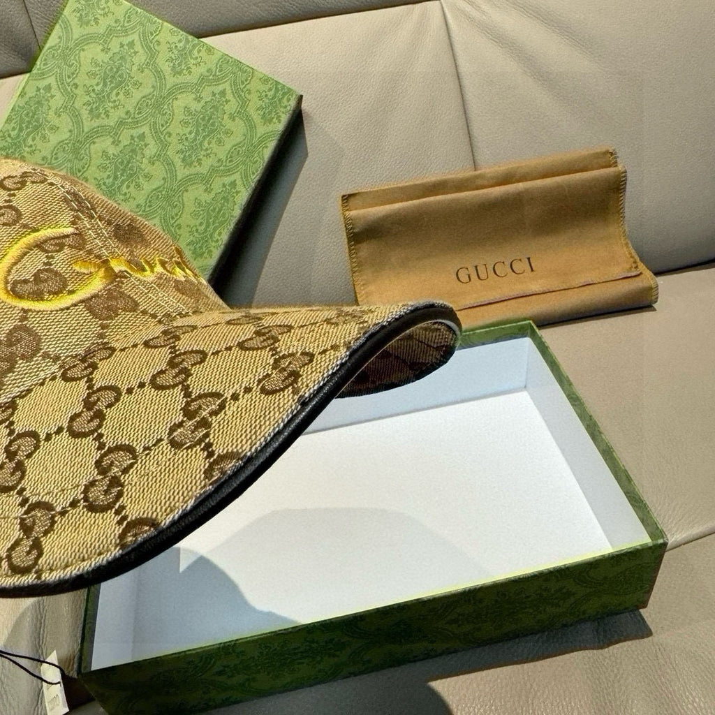 Gucci baseball cap brim close-up in beige GG monogram canvas with black trim