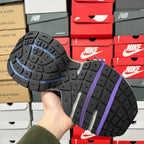 Balenciaga unisex sneaker outsole with dark tread and purple-striped detail