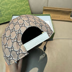 Gucci baseball cap with beige GG monogram and black-lined interior with white strap patch