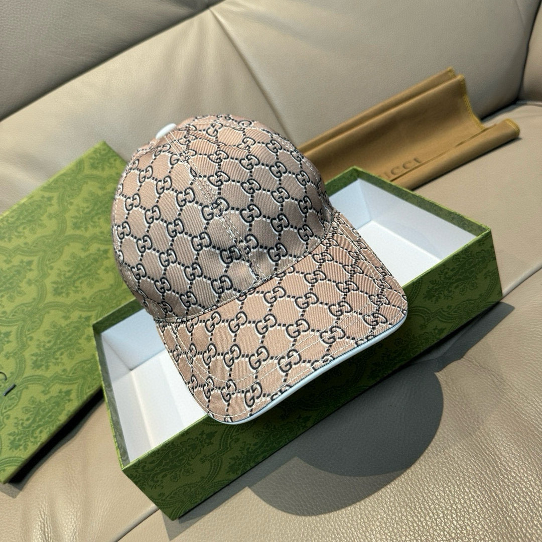 Gucci baseball cap with beige and dark GG monogram pattern, curved brim and stitched crown