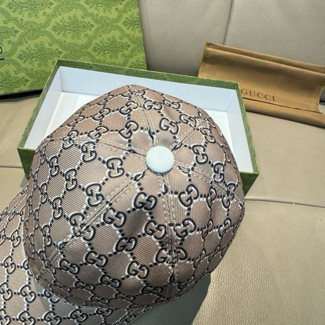 Gucci baseball cap top view with beige GG monogram and round light button detail