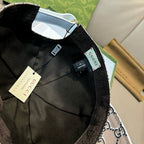 Gucci cap interior close-up with black lining, label and adjustable strap detail