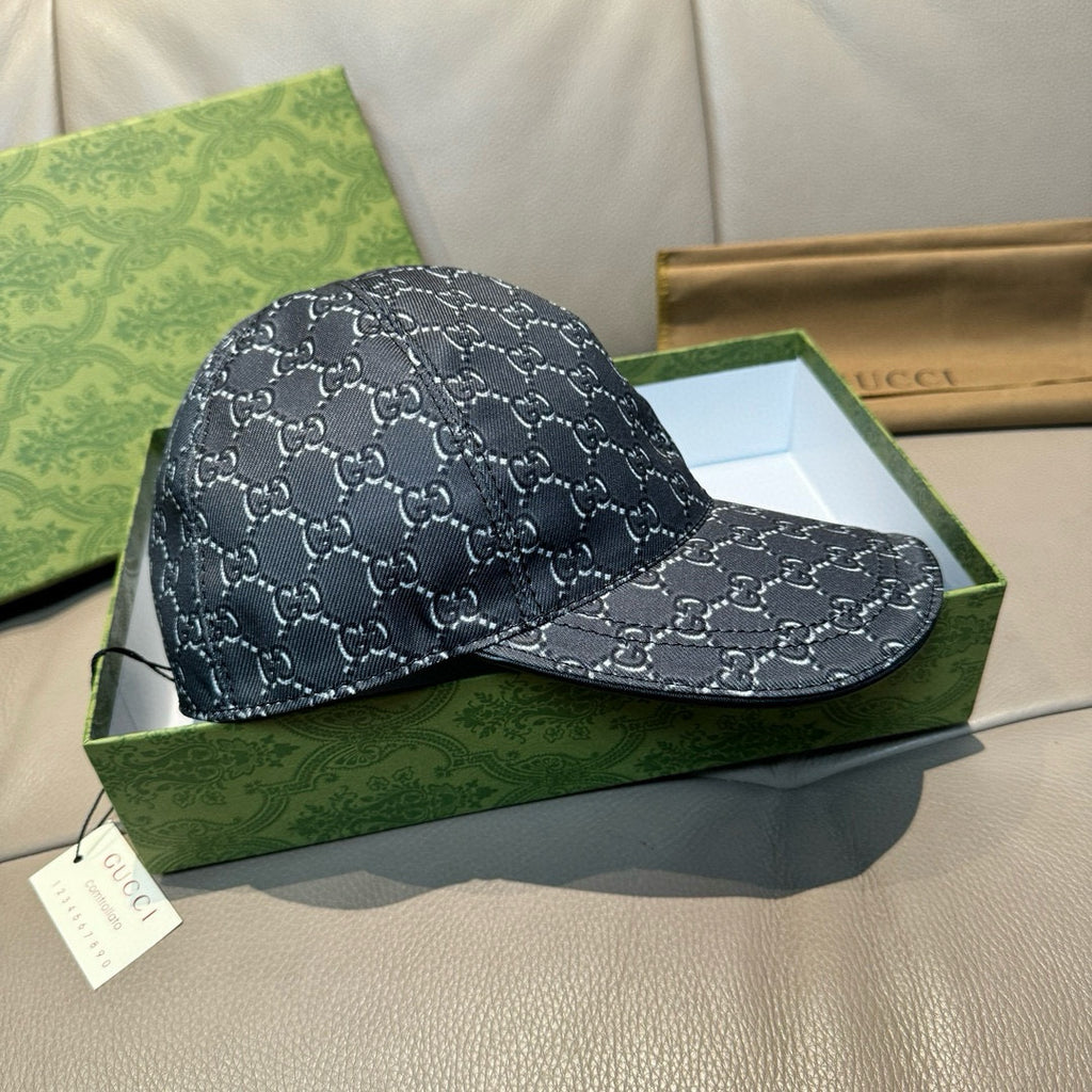 Gucci baseball cap in dark navy with GG monogram pattern and curved brim, side view