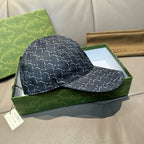 Gucci baseball cap in dark navy with GG monogram pattern and curved brim, side view