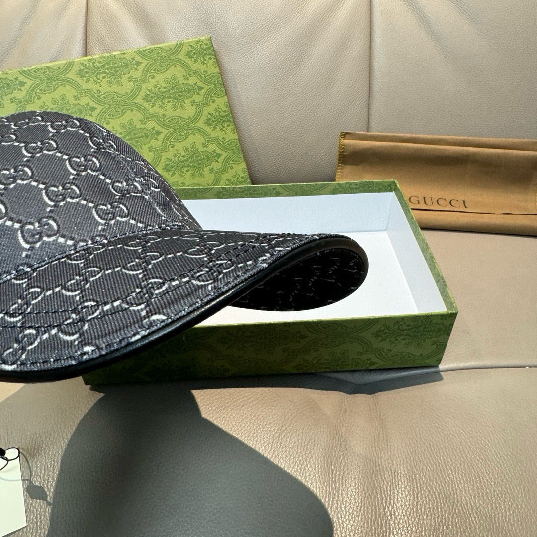 Gucci baseball cap dark navy with GG monogram pattern, brim edge close-up
