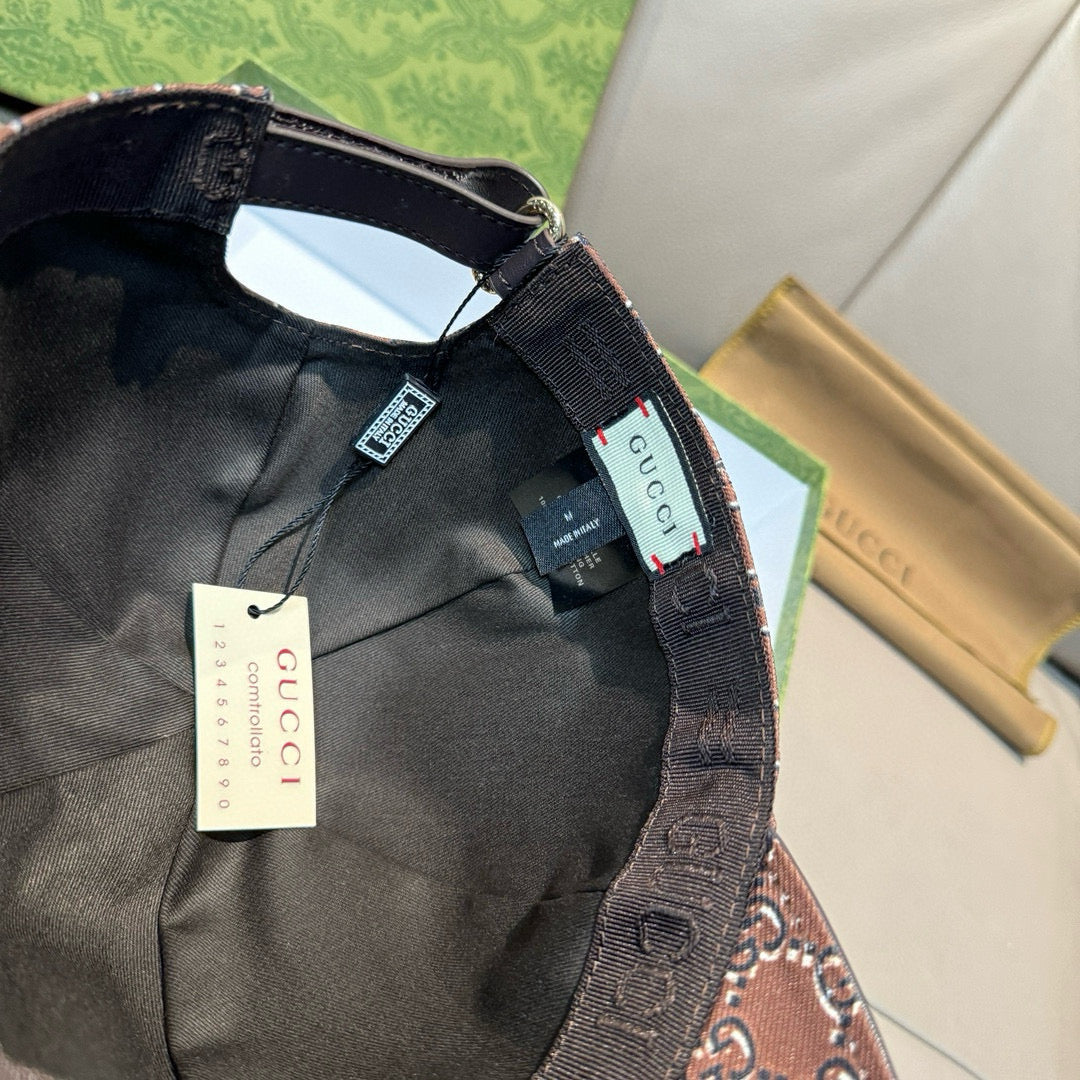 Black Gucci baseball cap interior view with black lining and adjustable strap.
