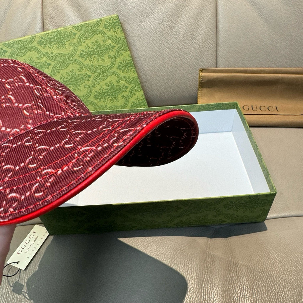 Burgundy GG-pattern cap with red-edged brim and visible inner lining