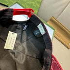 Black cap interior with red strap detail and hanging size label