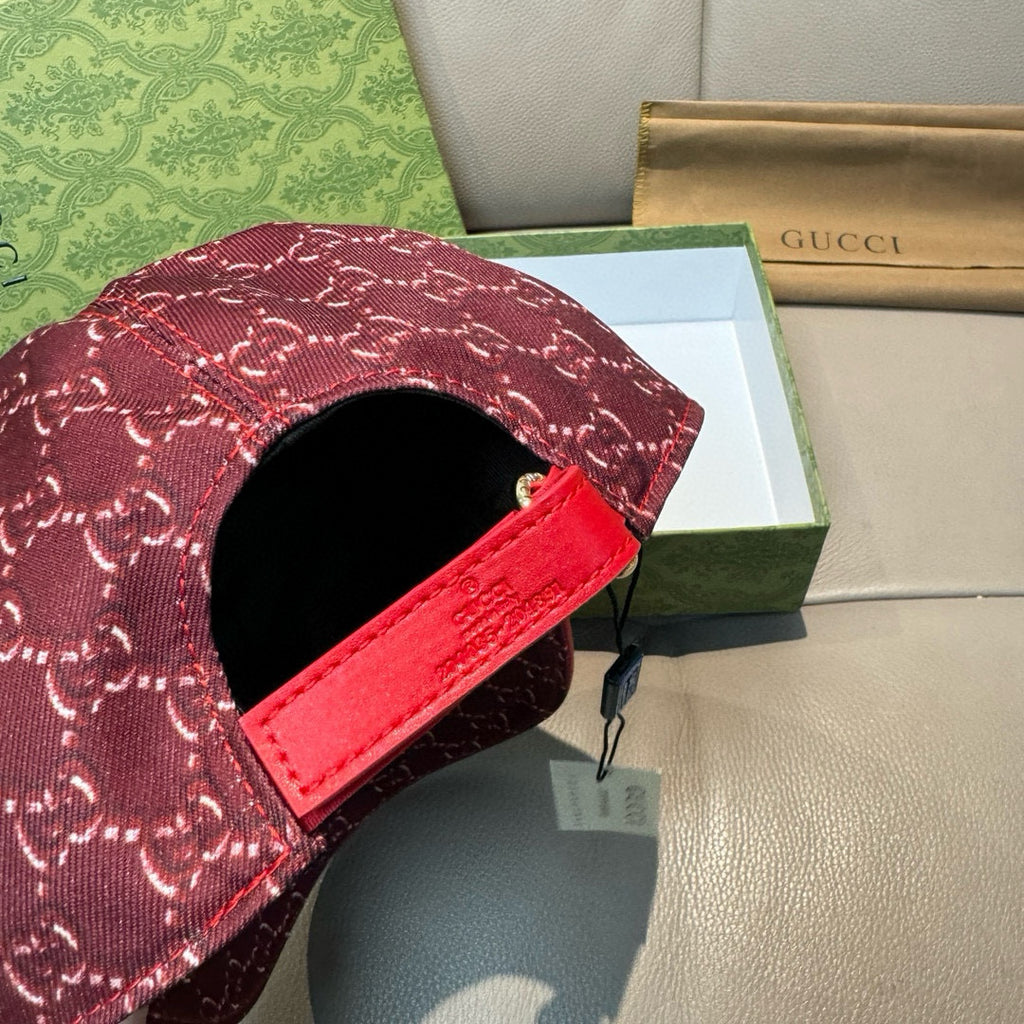 Burgundy GG-pattern cap with red strap and black inner opening