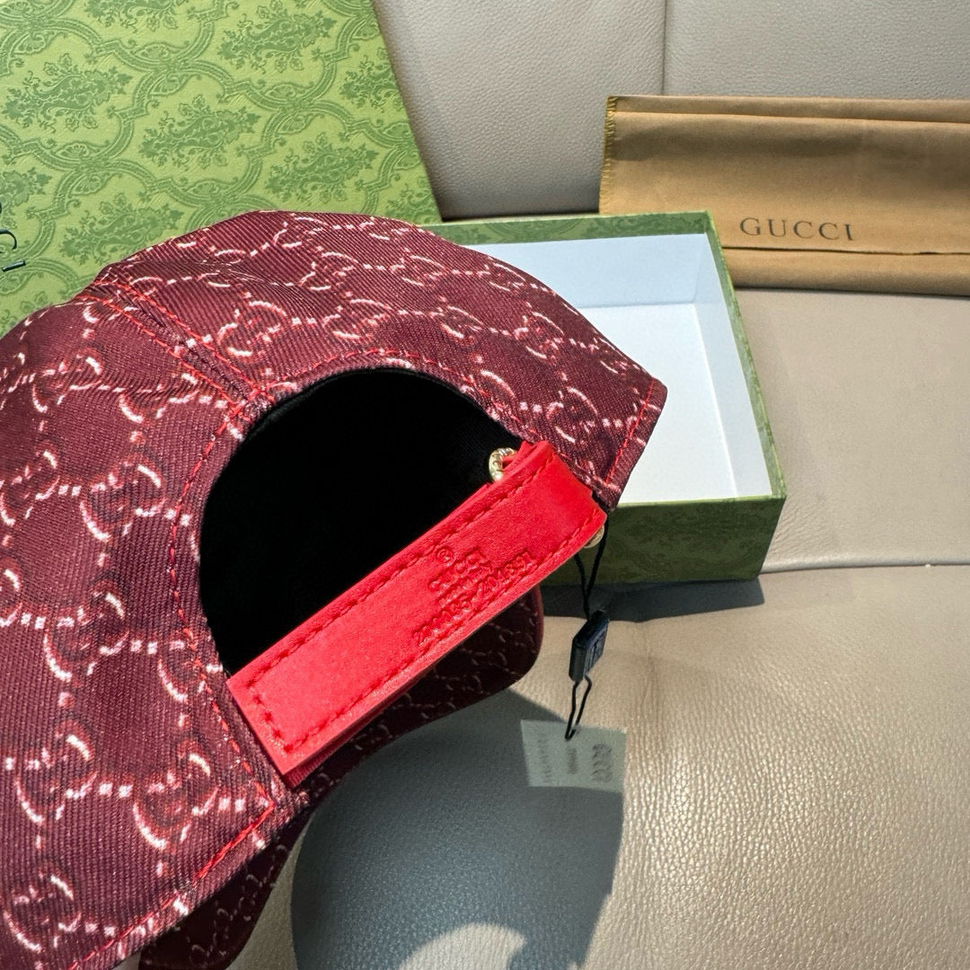 Burgundy GG-pattern cap with red strap and black inner opening