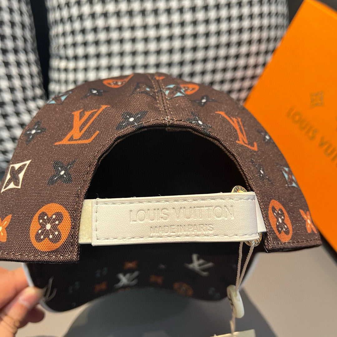 Louis Vuitton cap with white logo label on inside back and dark brown monogram