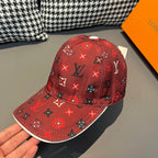 Red Louis Vuitton baseball cap with monogram print, curved brim, and top button