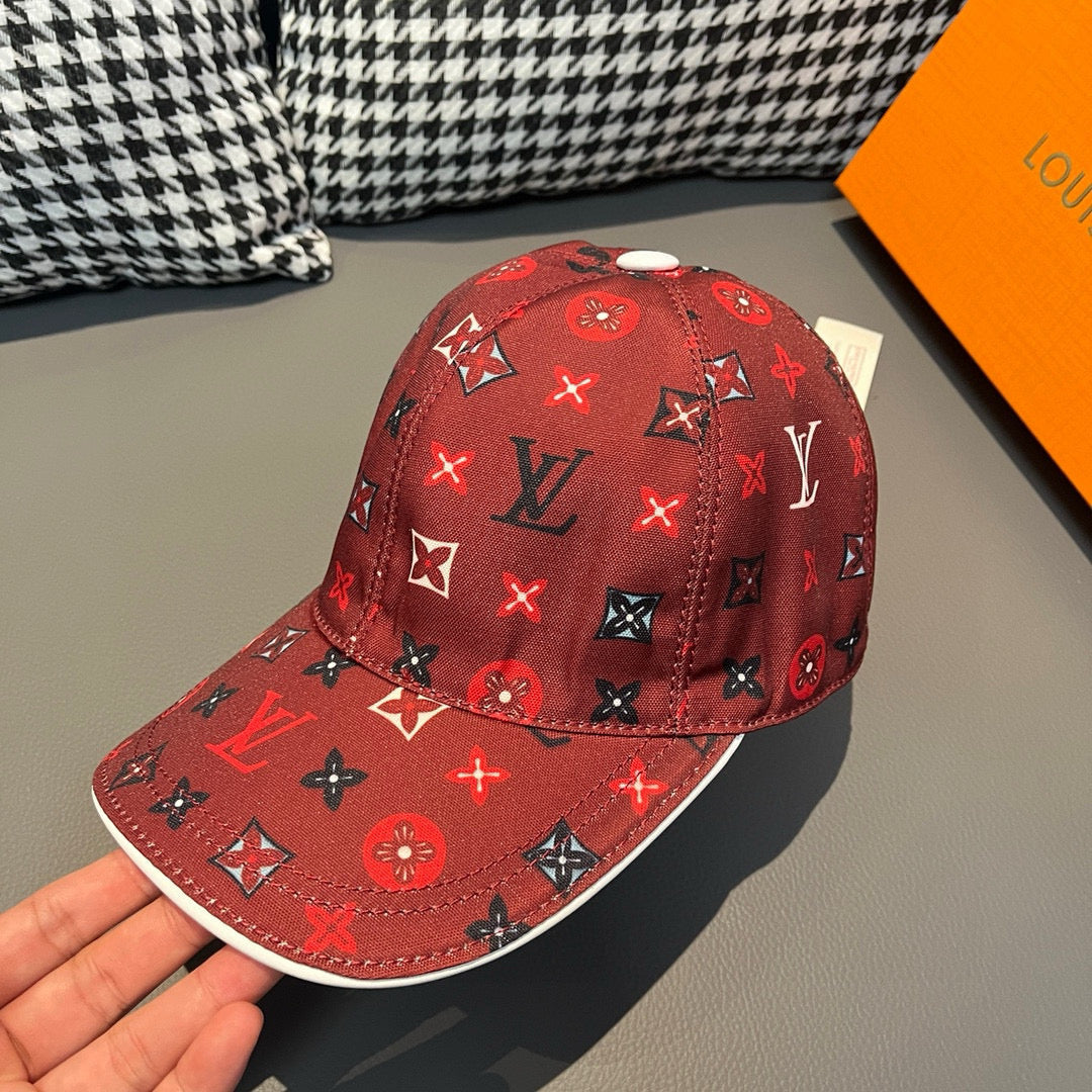 Red Louis Vuitton baseball cap with monogram print, curved brim, and top button