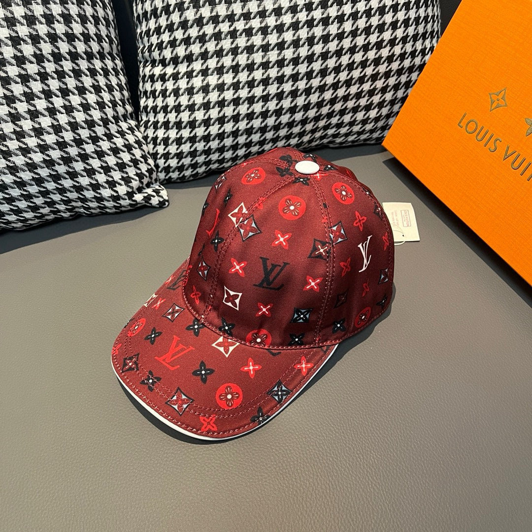 Red Louis Vuitton baseball cap with allover monogram pattern and curved brim