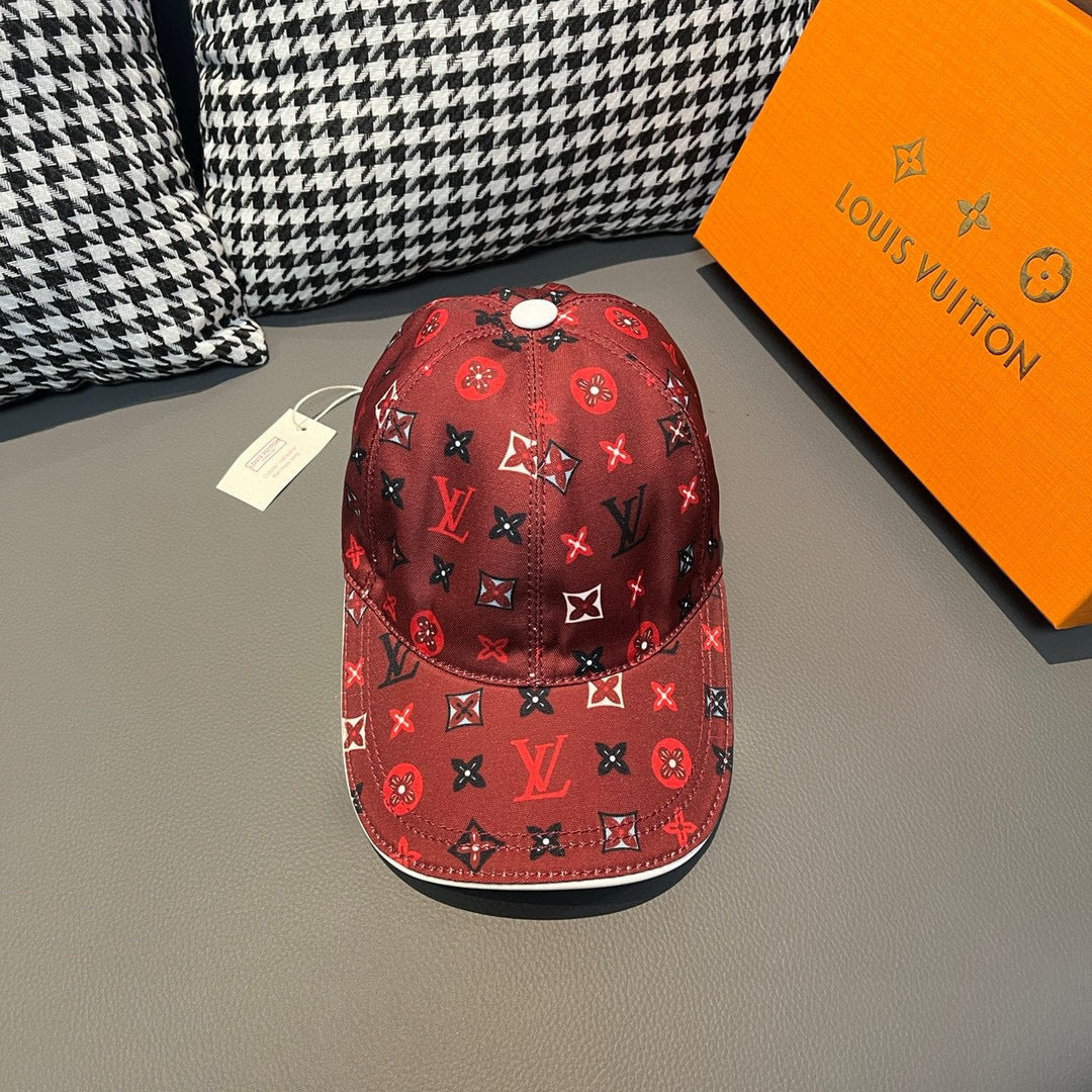 Red Louis Vuitton baseball cap with repeating monogram icons and curved brim
