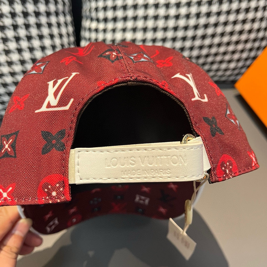 Red Louis Vuitton cap with black interior and light fabric strap with logo