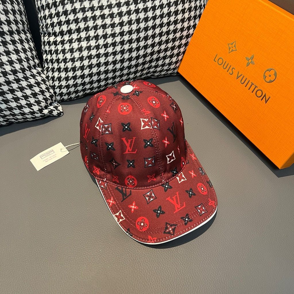 Red Louis Vuitton baseball cap with repeating logo-style icons and curved brim