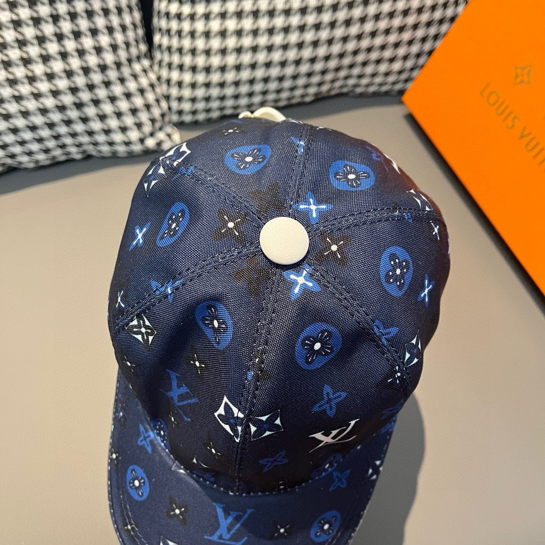 Louis Vuitton navy patterned baseball cap top view with white snap button and monogram motifs