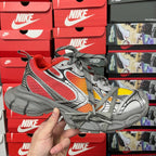Red, gray and yellow mesh sneaker with gray laces and thick cushioned sole
