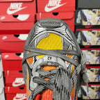 Red, yellow and orange panel sneaker close-up with gray laces and textured toe