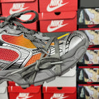 Red, orange and gray mesh sneaker with padded heel and gray laces