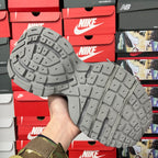 Gray rubber sneaker outsole with deep tread pattern